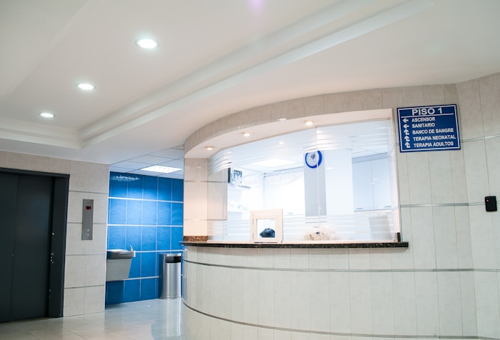 A bright modern hospital reception and waiting area